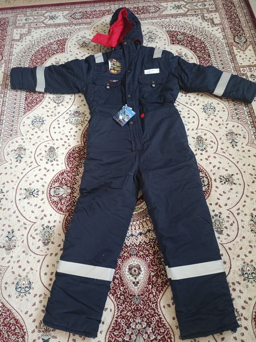Продам зимний комбинезон новый