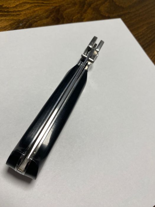 Сгъваем нож с текстилен калъф.