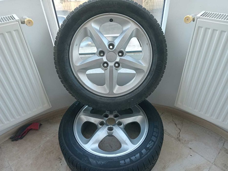 Set cauciucuri de iarna cu genti