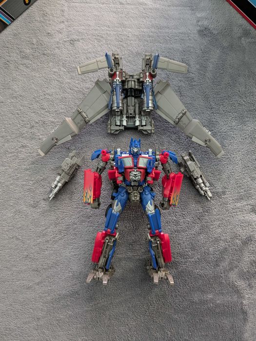 Figurină Transformers SS DOTM Optimus Prime + DNA Design Upgrade Kit