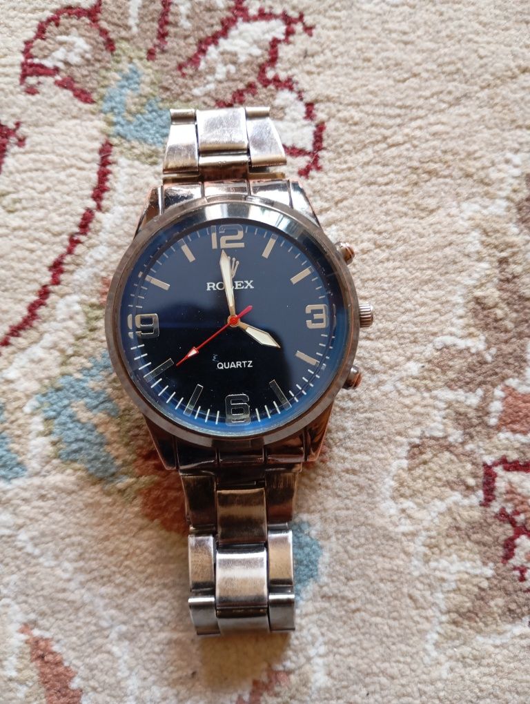 Сағат ROLEX Шымкенттің сағатын көрсетеді