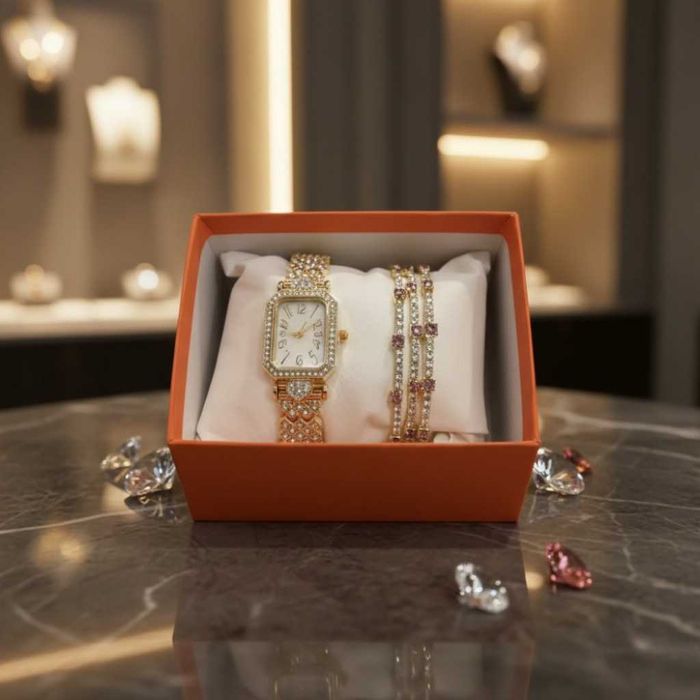 Луксозен дамски комплект: часовник и гривни в златист цвят.