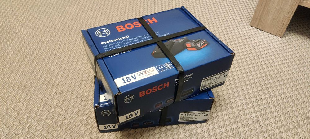 Cutie sigilata Set incarcator 4A + acumulator Bosch 18V 4Ah, original.