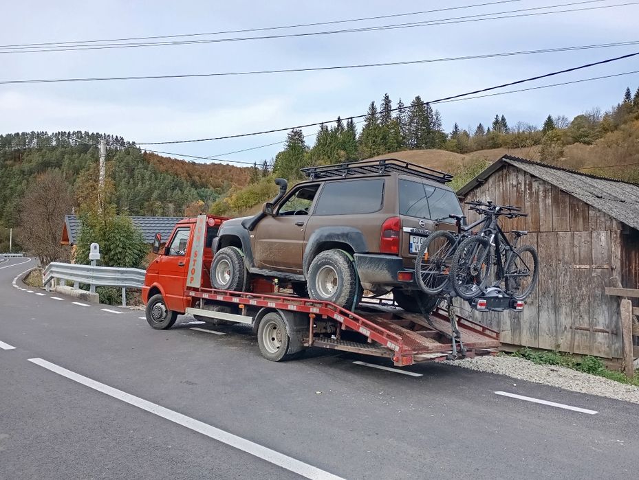 Tractari auto platforma transport utilaje trailer slep recovery