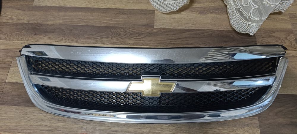 Ласетти облицо́вка