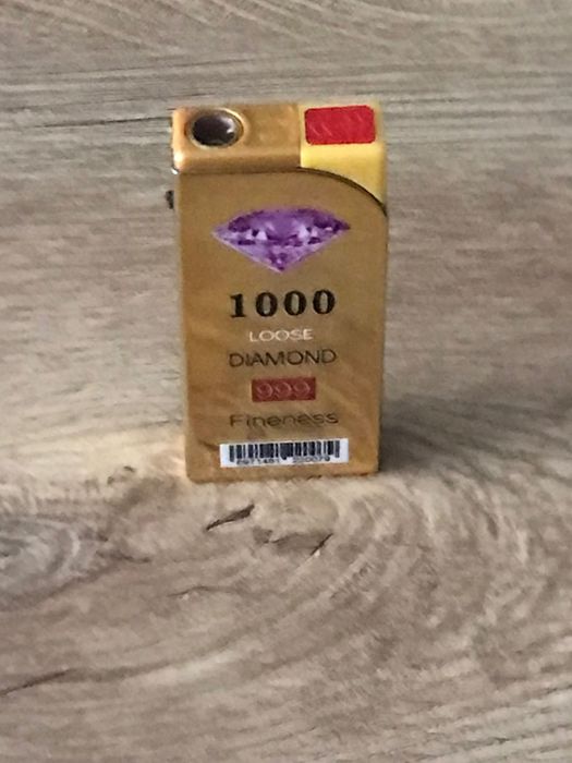 Златиста запалка  против вятър