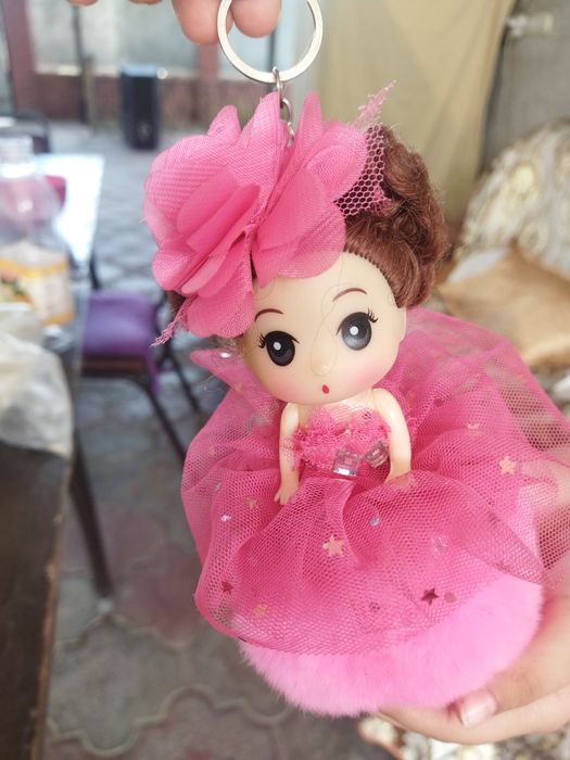 Куколка с брелочком.