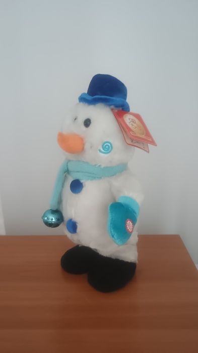 Jucărie -Om de zapada- dansează și cântă.