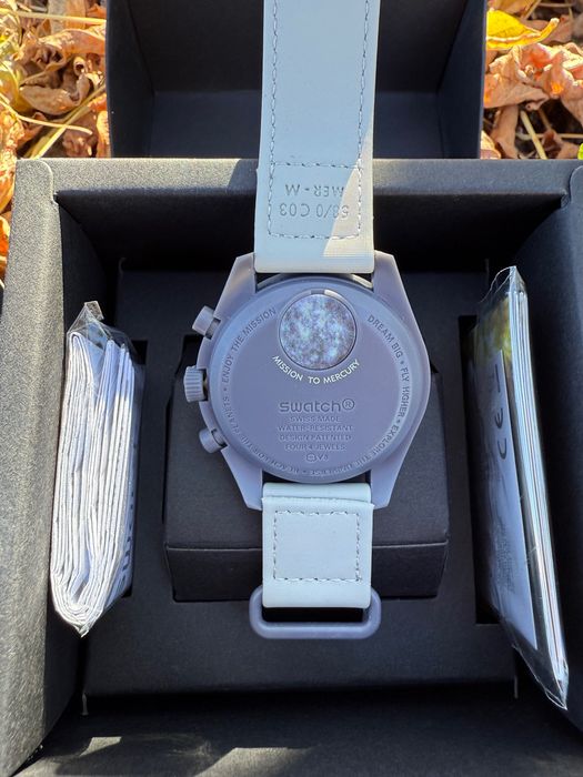 Omega Swatch mission to mercury sun pluto earth venus neptune uranus