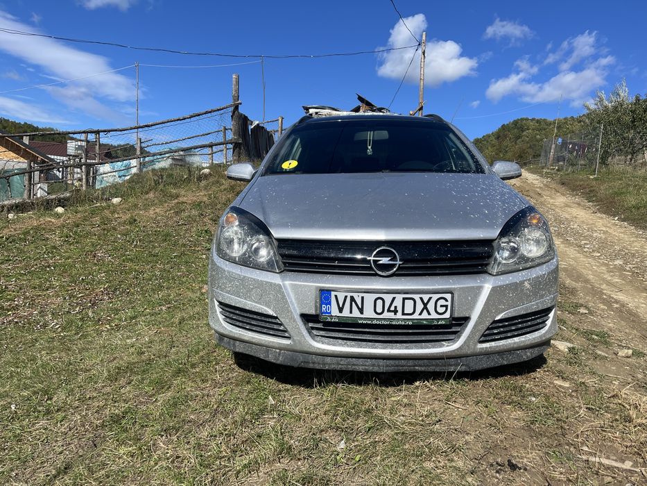 Vand sau schimb opel asta h  pret :2300€