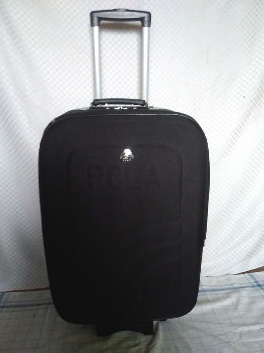 Среден-голям куфар с колелца и телеск.дръжка