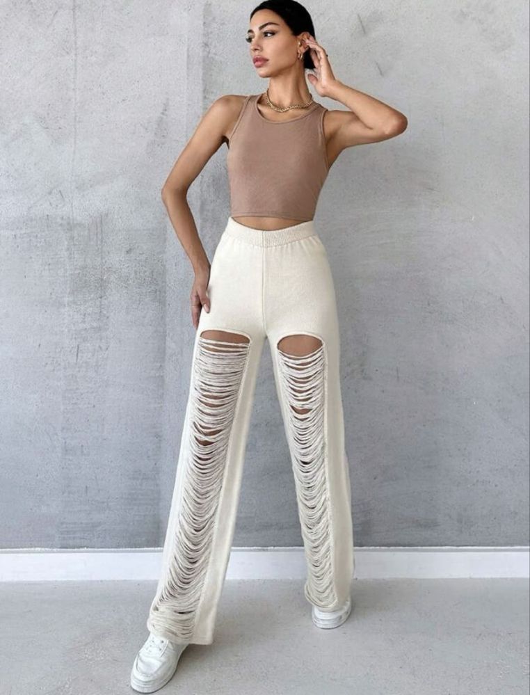 Pantaloni albi de plaja rupti
