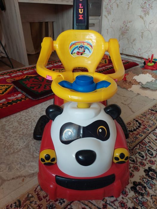 Продам машинку каталку новую