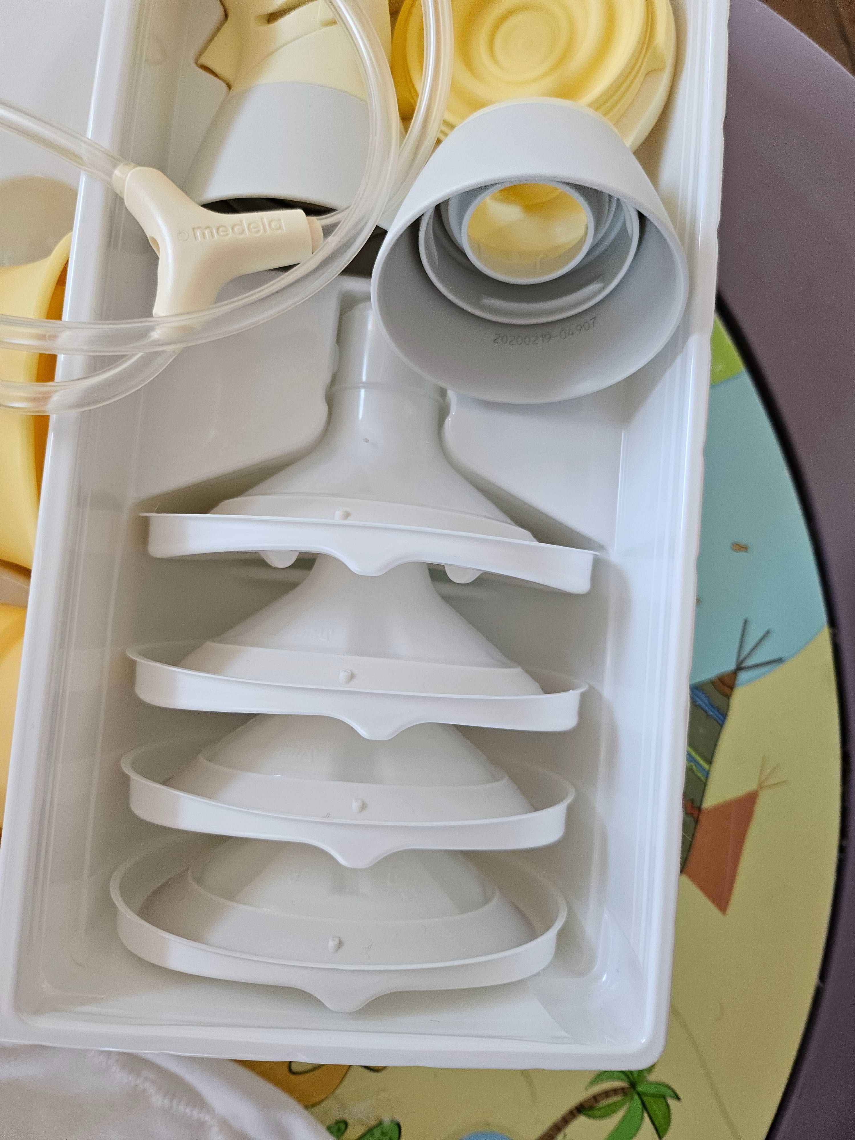 medela  със СУТИЕН двуфазна двойна електрическа помпа maxi