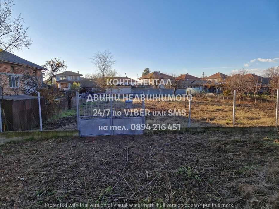 код.62561.Парцел 600м2 заграден, поддържан до къщи на тихо място