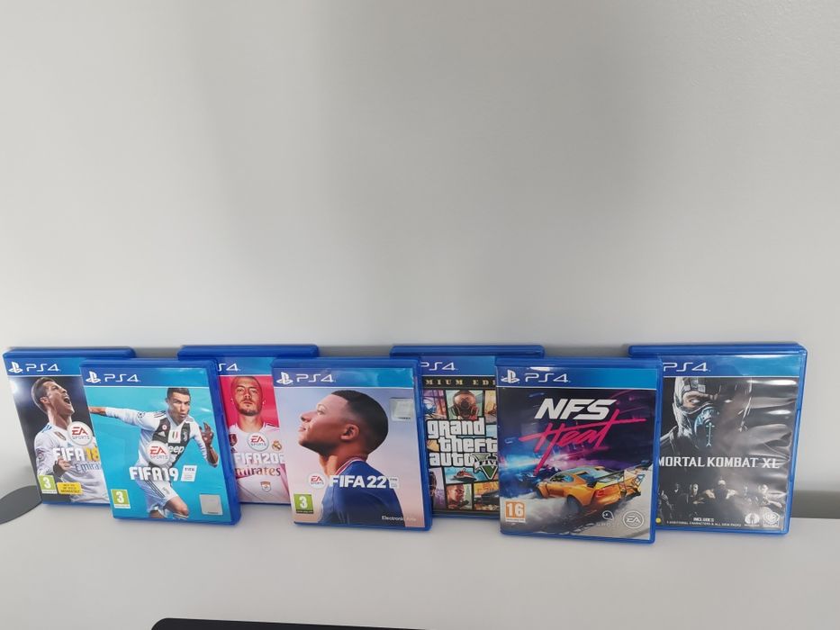 PlayStation 4 Slim – 1TB + 2 manete + 7 jocuri