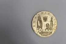 Moneda rara cu auriu strălucitoare