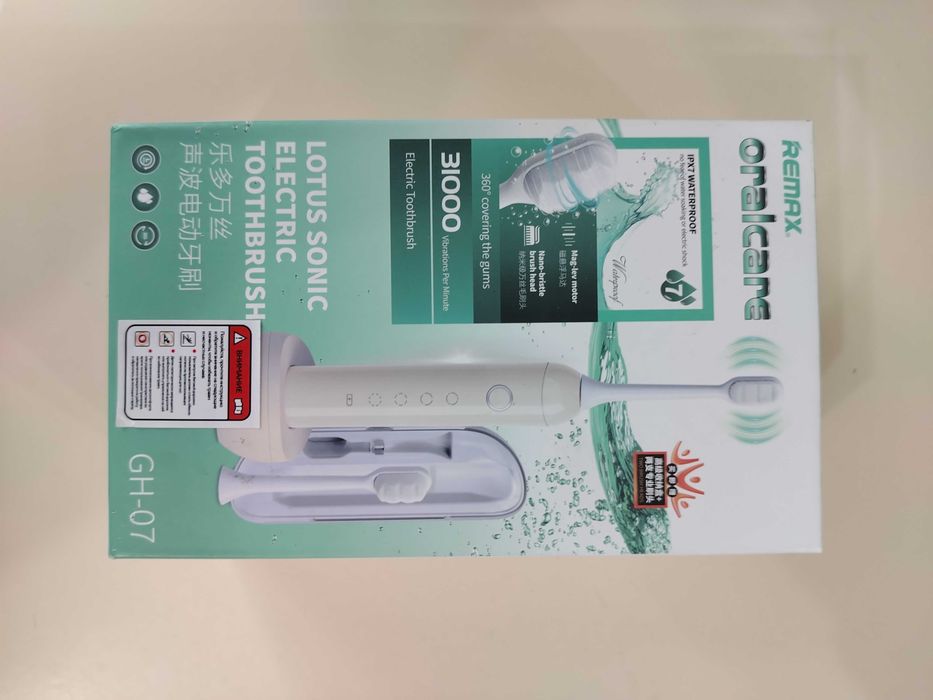 Электрическая зубная щетка