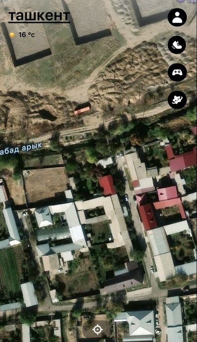 Янги Узбекистон Парк! orqasda joylashgan