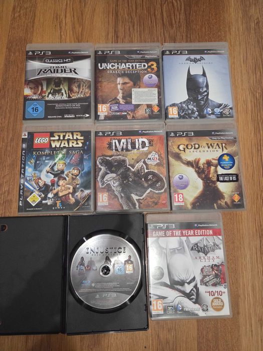 Lot 8 jocuri originale PS3 – Uncharted 3, Tomb Raider Trilogy, GoW