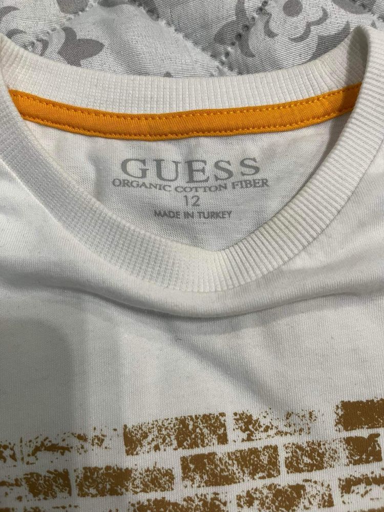 Guess -12 год