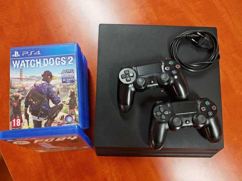 PlayStation 4 Pro 1TB cu 2 controllere și jocuri – stare foarte bună