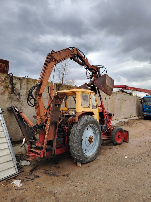 ЮМЗ с грайферен устройство