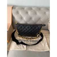 Louis Vuitton model Coussin bag