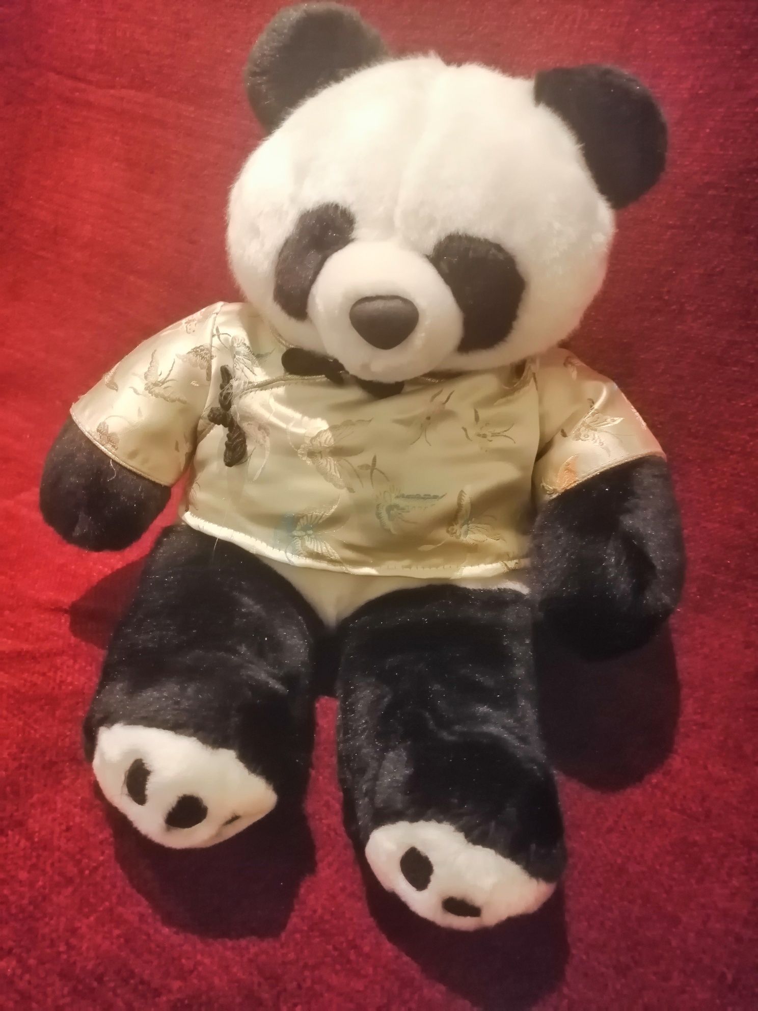 Детская игрушка панда