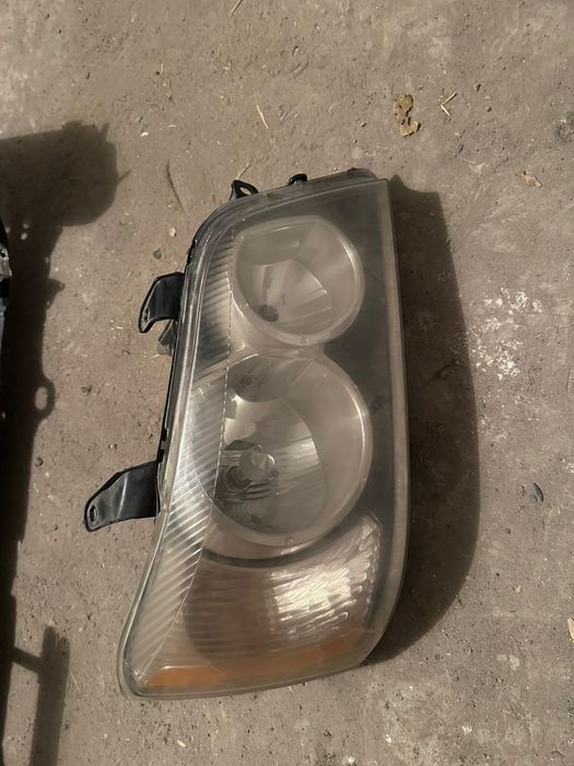 Фара на хайландер 2002 года