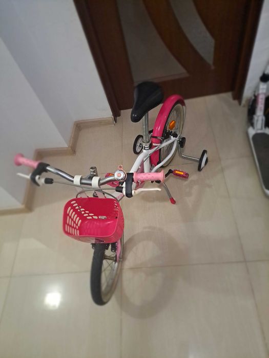 Bicicleta BTwin roz  pentru copii 4 - 8  ani