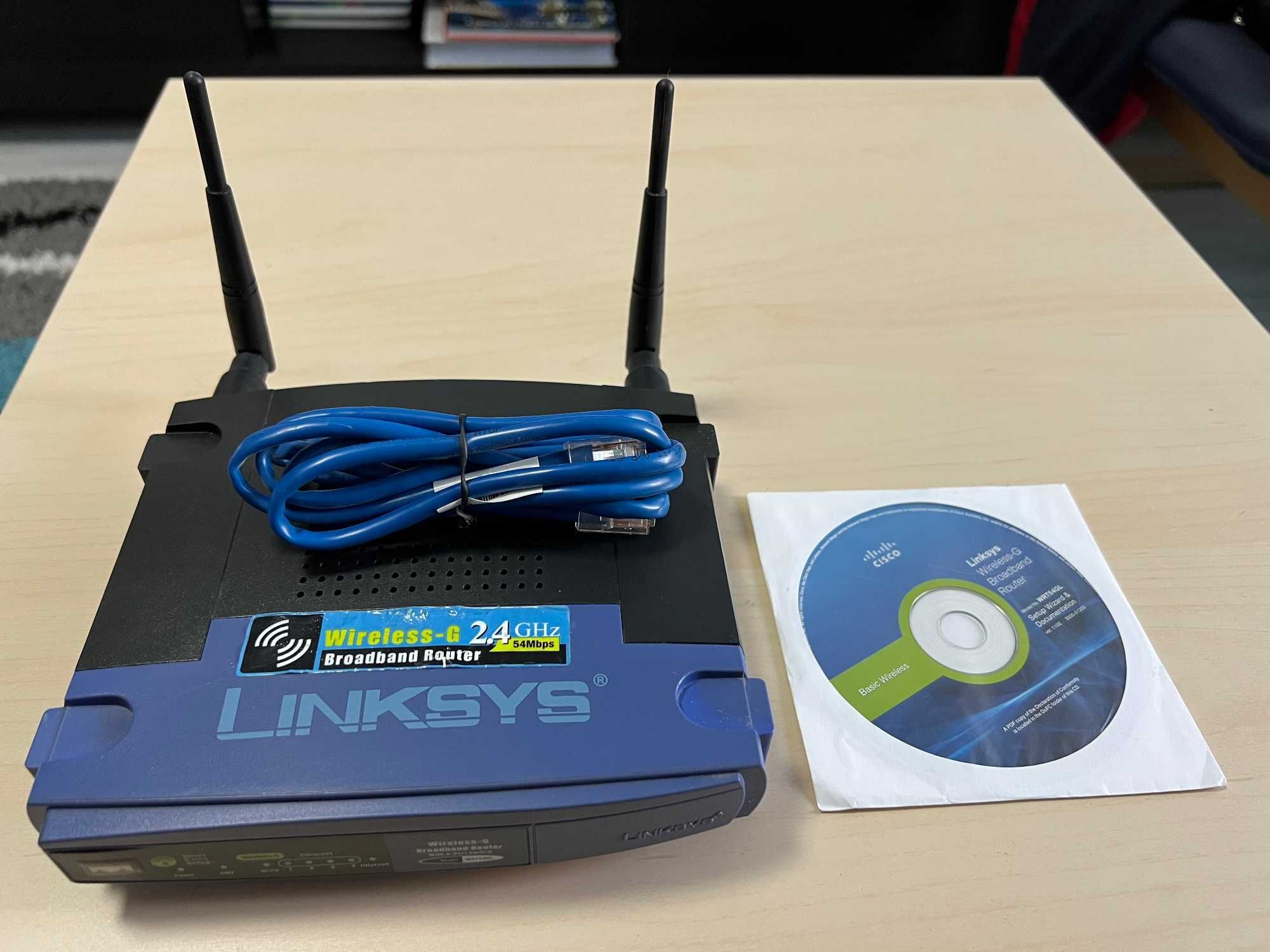 Vand router wireless Linksys RT54GL + cablu de retea+CD instalare