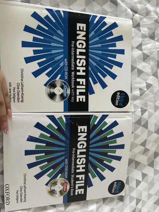 English file pre-intermediate , workbook , students book .