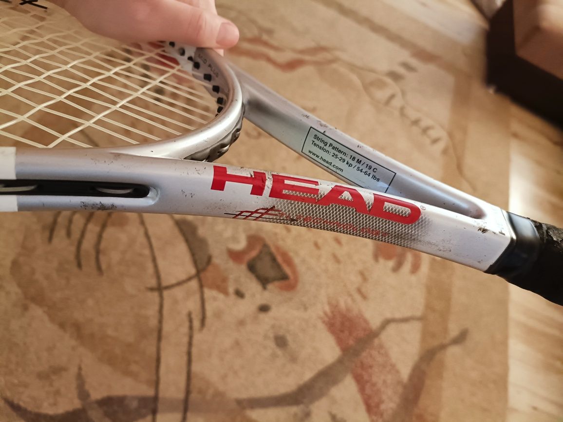 родам теннисную ракетку Head.