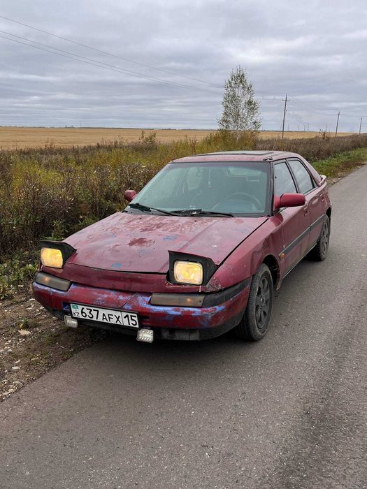 Автомобиль Mazda 323f bg