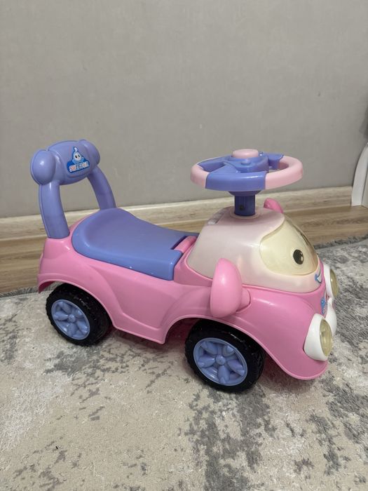 Детская машинка каталка музыкальная