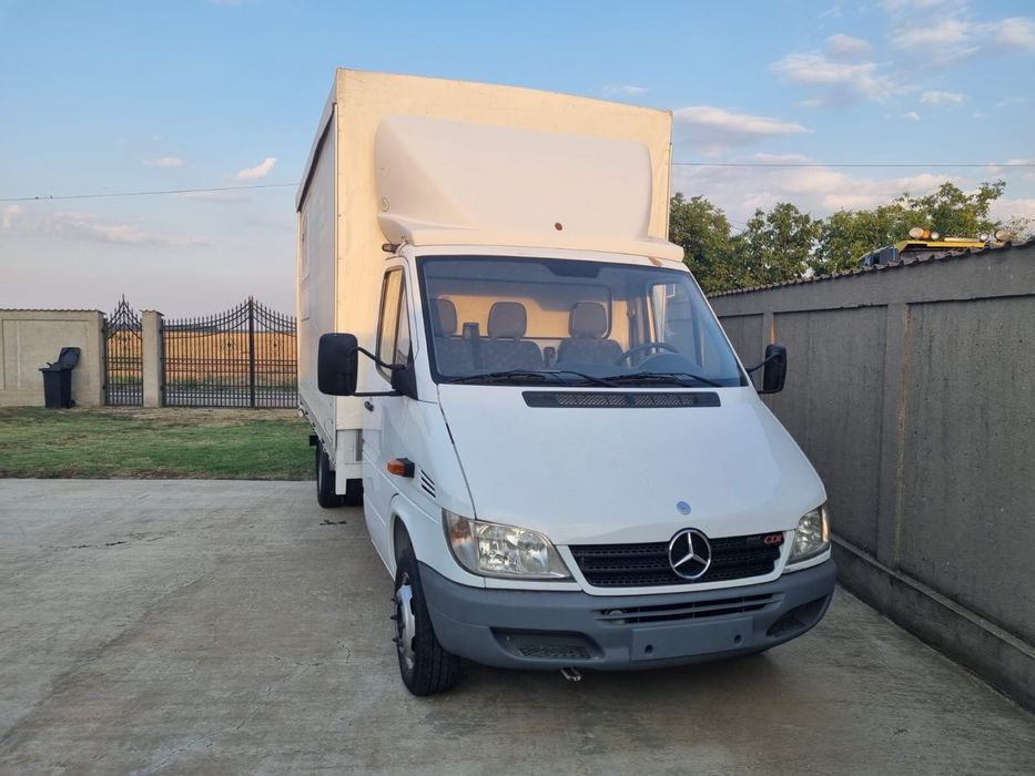 Mercedes sprinter 416 cu bena ficsa cu prelata care se inalta .
