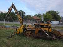 Tractor senilat cu lama si excavator in spate