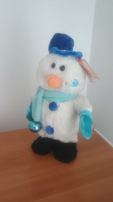 Jucărie -Om de zapada- dansează și cântă.