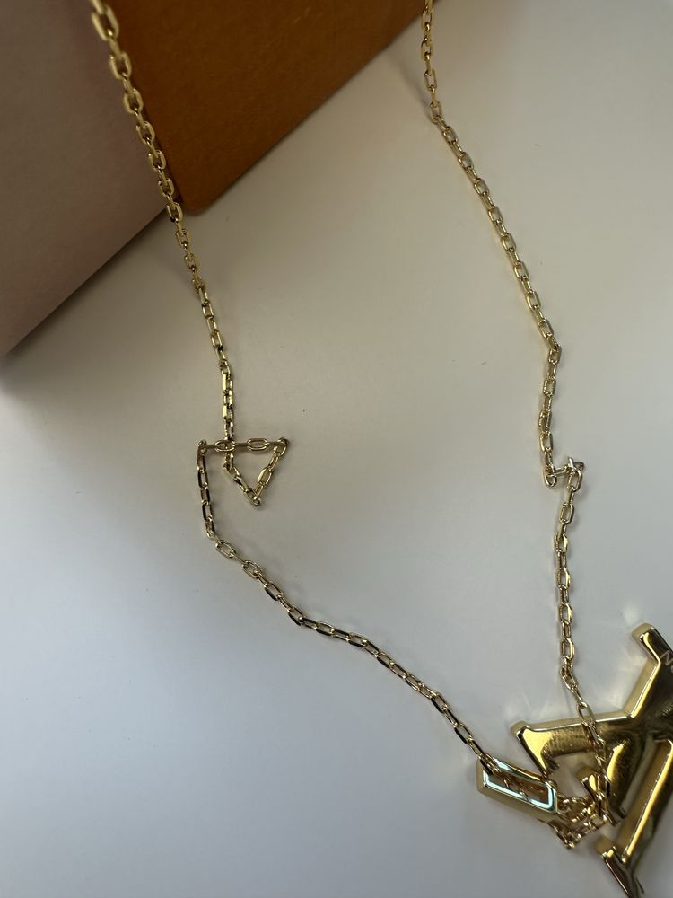 colier louis vuitton auriu