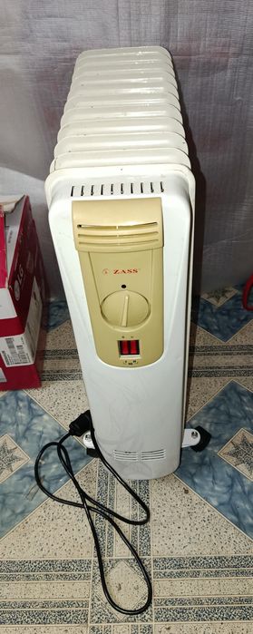 Масляный обогреватель 11 секций.Состояние и греет отлично.Гарантия.