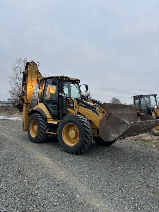 Buldoexcavator CAT 444 F . 2015