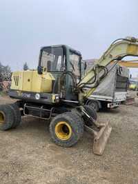 Societate Comerciala vinde excavator YANMAR B50W pe roti