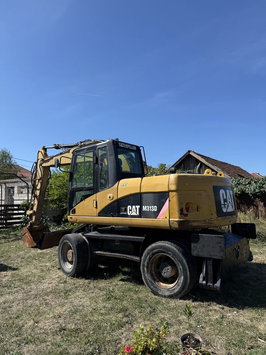 Excavator pe pneuri CAT m313d