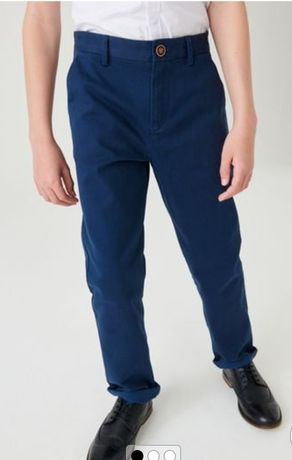 Продам синие школьные брюки слаксы (чиносы) Next