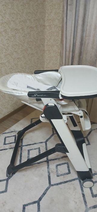 Фирменный стульчик для кормления