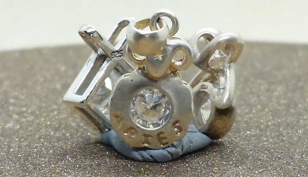 Lot 3 pandantive argint cu zirconii inclusiv ARIES