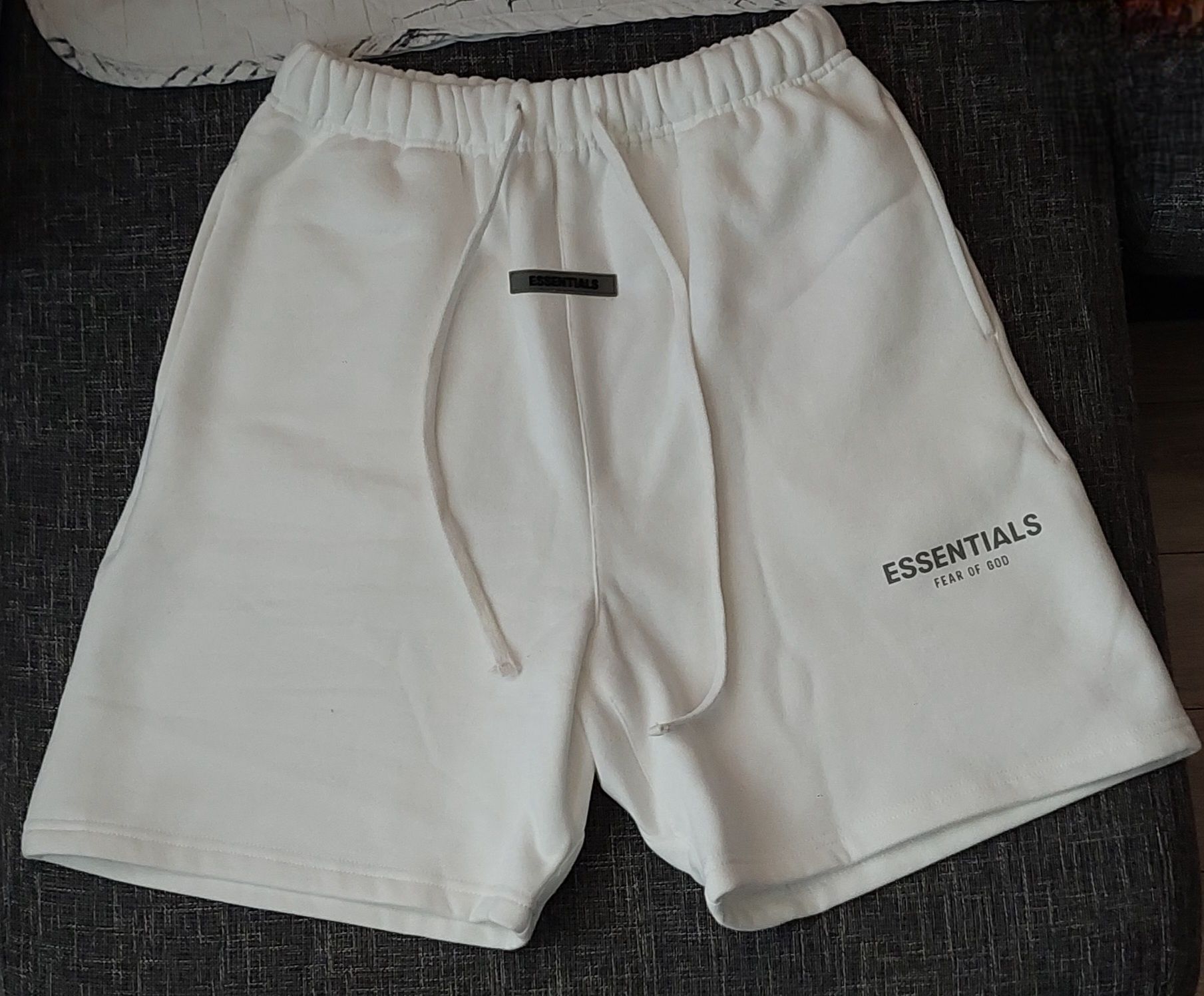 Fear of God Essentials white shorts