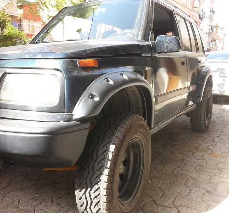 OVERFENDERE Suzuki Vitara 5 usi - latime 7 cm + kit garnituri/suruburi