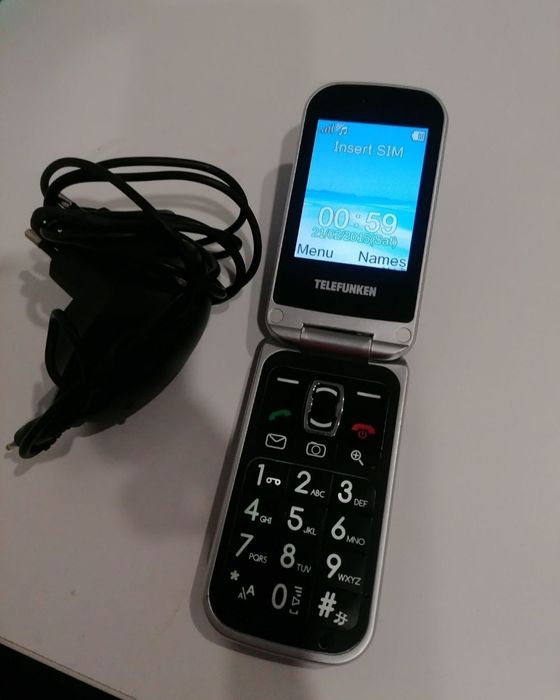 Telefon cu clapeta cu încărcător